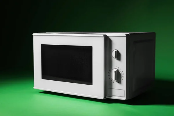 White Microwave Oven Opened Door Green Background — Stock Photo, Image