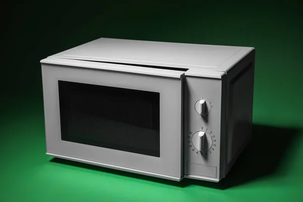 White Microwave Oven Opened Door Green Background — Stockfoto