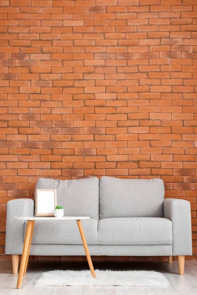 Stylish Sofa Table Brick Wall — Stock Photo, Image