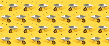 Sarı arkaplanda boş el arabaları