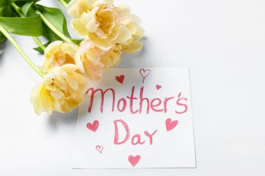 Card with text MOTHER'S DAY and yellow flowers on white background