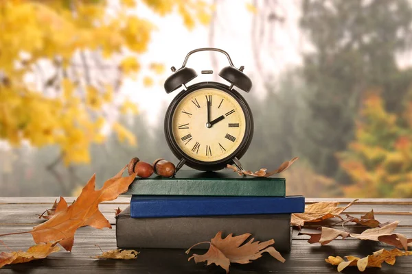 Alarm Clock Books Autumn Leaves Table Outdoors — Foto de Stock