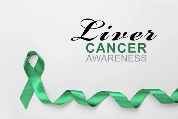 Green ribbon and text LIVER CANCER AWARENESS on light background