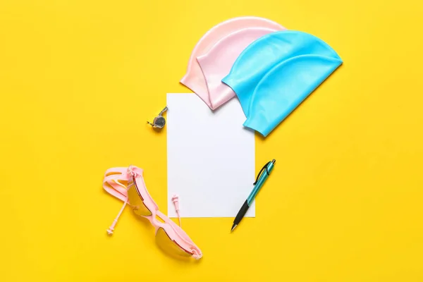 Paper Sheet Swimming Caps Goggles Whistle Pen Yellow Background — Fotografia de Stock