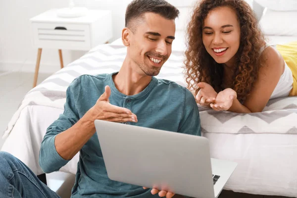 Young Couple Using Modern Laptop Bedroom — Foto de Stock