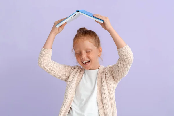 Happy Little Redhead Girl Book Lilac Background — Fotografia de Stock