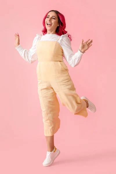 Beautiful Woman Bright Hair Jumping Pink Background — ストック写真