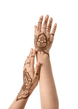 Female hands with beautiful henna tattoo on white background