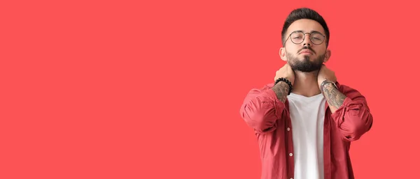 Stylish Young Tattooed Man Red Background Space Text — стоковое фото