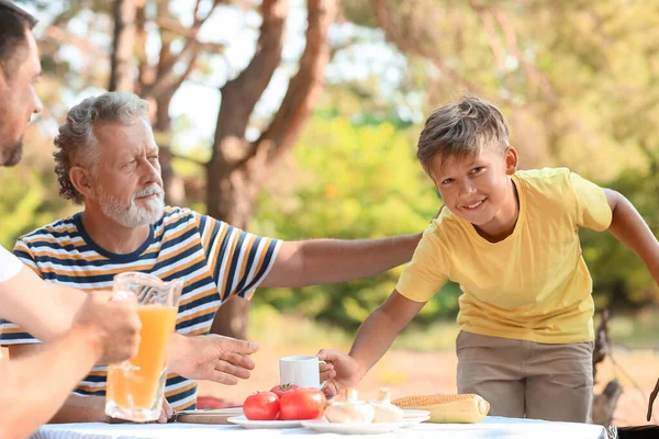 Little Boy Giving Cup His Father Barbecue Party Summer Day — Stock Photo, Image