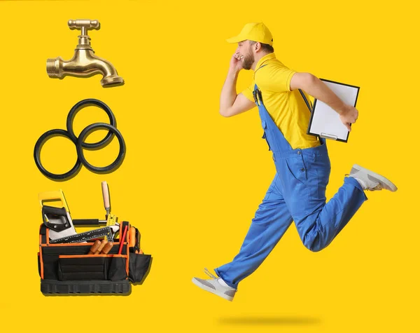 Running Male Plumber Different Equipment Yellow Background — Foto de Stock