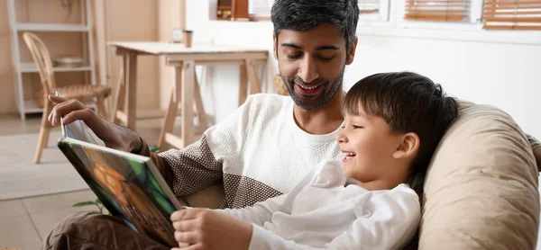 Father Little Son Reading Interesting Book Home — Stockfoto
