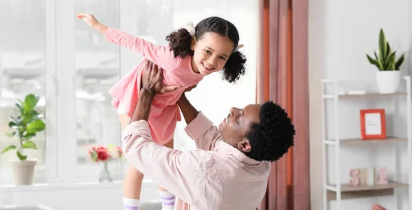 Happy African American Man Playing His Little Daughter Home — Foto de Stock
