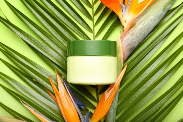Jar Cosmetic Product Palm Leaf Strelitzia Flowers Green Background Closeup — Stock Photo, Image