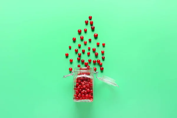 Glass Jar Scattered Lingonberries Green Background — Stock Photo, Image