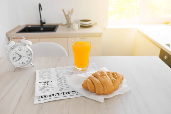 Tasty Croissant Glass Juice Newspaper Dining Table Kitchen — Stock Photo, Image