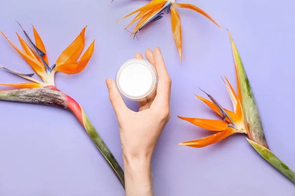 Female Hand Jar Cream Beautiful Strelitzia Flowers Color Background — Stock Photo, Image