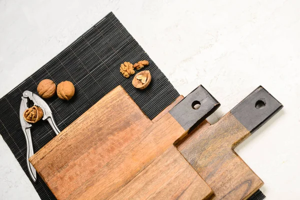 Wooden Cutting Boards Nutcracker Walnuts Light Background Closeup — Stockfoto