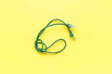Modern internet cable on yellow background