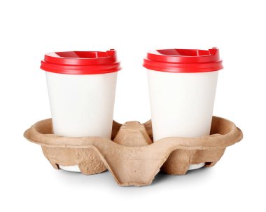 Holder with takeaway paper cups on white background