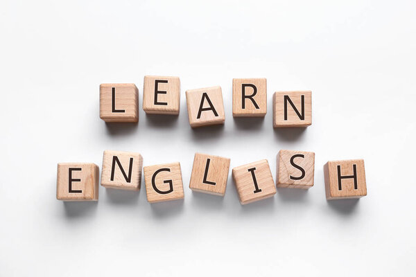 Text LEARN ENGLISH made of cubes on white background