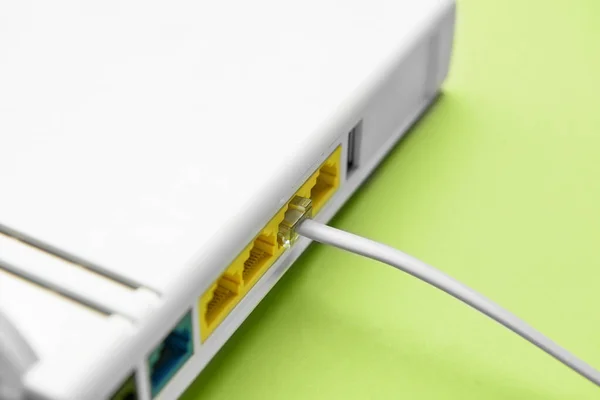 Modern Router Internet Cable Green Background Closeup — 스톡 사진