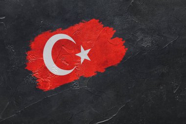 Flag of Turkey painted on dark grunge background