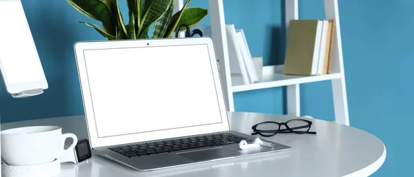 Modern Laptop Earphones Eyeglasses Cup Table — Zdjęcie stockowe