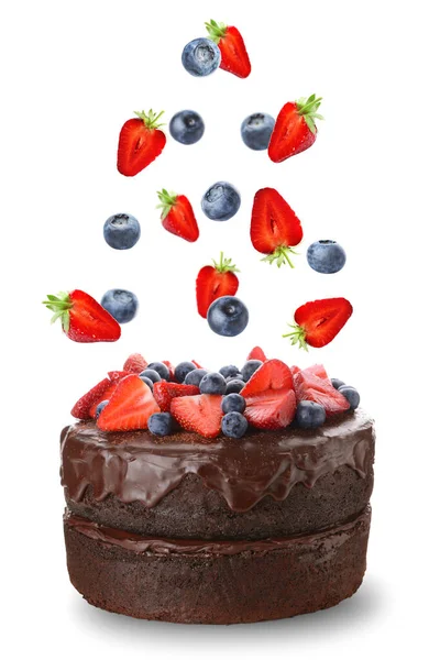 Tasty Chocolate Cake Falling Fresh Berries White Background — Stock Photo, Image