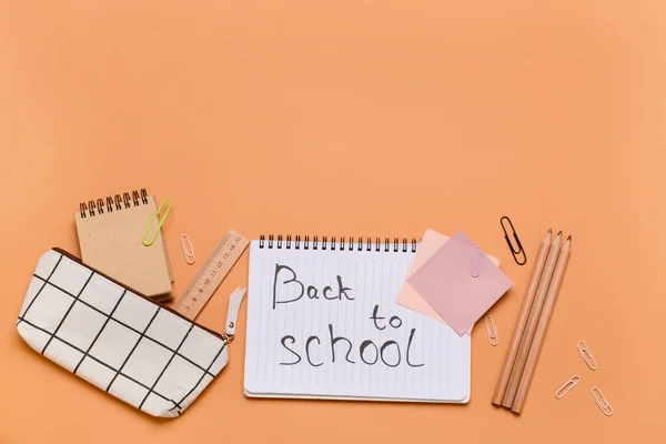 Stationery Supplies Text Back School Orange Background — Zdjęcie stockowe
