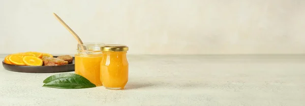 Glass Jars Tasty Orange Jam Light Background Space Text — Stock Photo, Image