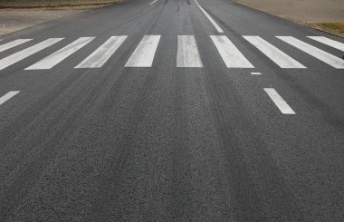 Zebra crosswalk on road in city clipart