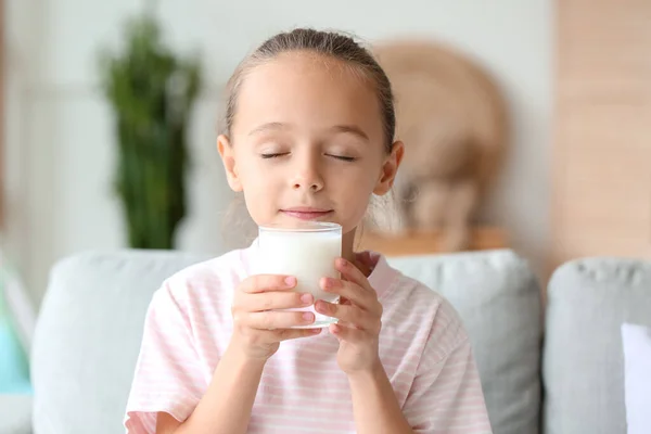 Little Girl Closed Eyes Drinking Milk Sofa — Zdjęcie stockowe