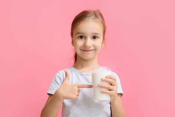 Cute Girl Pointing Glass Milk Color Background — Zdjęcie stockowe