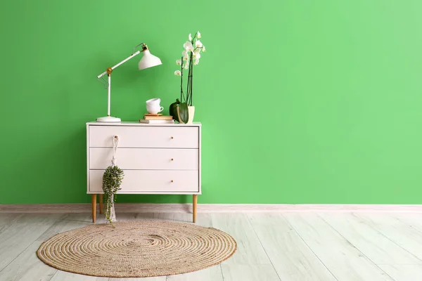 Chest Drawers Lamp Cups Orchid Flower Green Wall Room — 스톡 사진