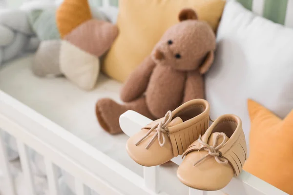 Baby Booties White Crib Nursery Closeup — Stock Photo, Image