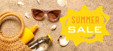 Set of beach accessories on sand. Banner for summer sale