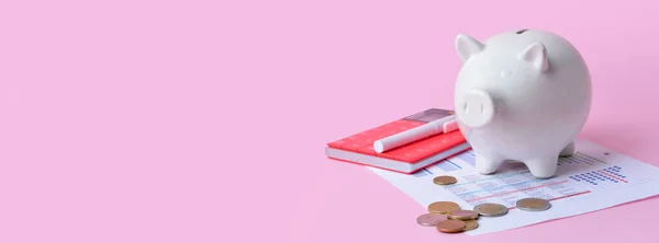 Piggy bank with coins, calculator and documents on pink background with space for text