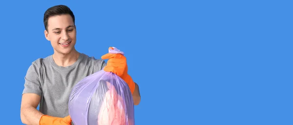 Young Man Holding Garbage Bag Blue Background Space Text —  Fotos de Stock