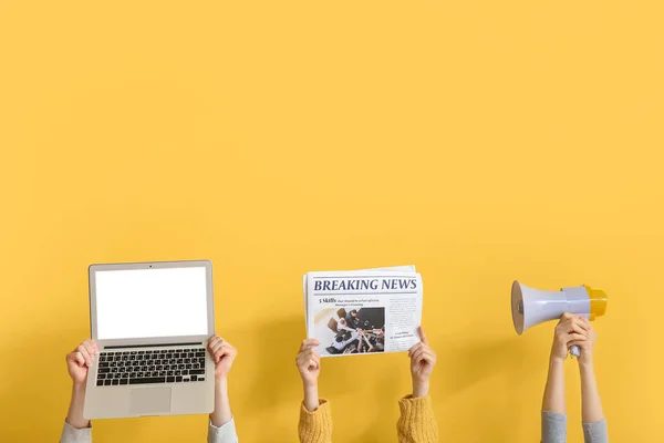 People Newspaper Laptop Megaphone Yellow Background — Stock Photo, Image