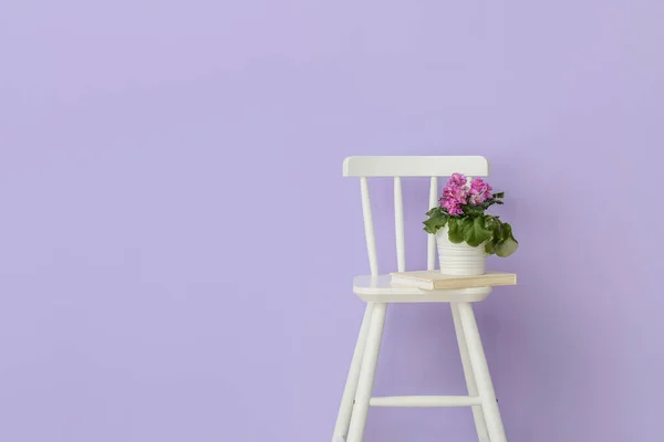 Chair Book Houseplant Violet Wall — Stock Photo, Image