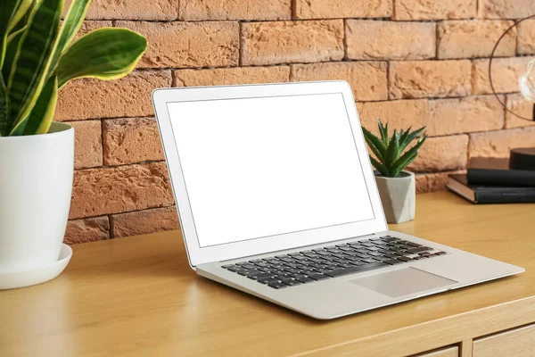 Modern Laptop Houseplants Wooden Table Brick Wall — Fotografia de Stock