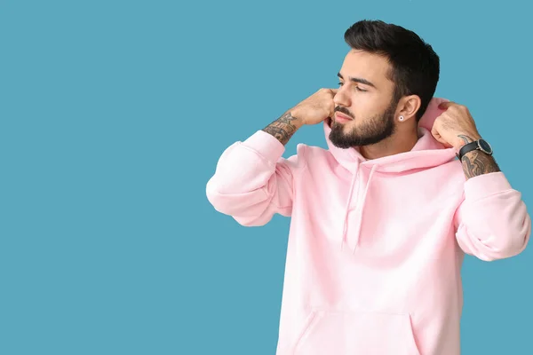 Fashionable Bearded Man Hoodie Looking Aside Blue Background — Stock Photo, Image