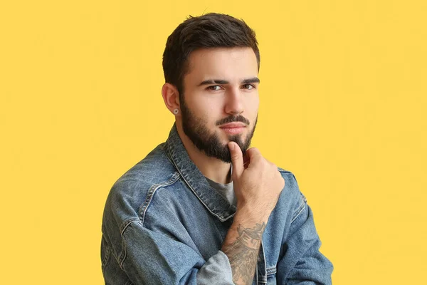 Fashionable Man Touching Beard Yellow Background — стоковое фото