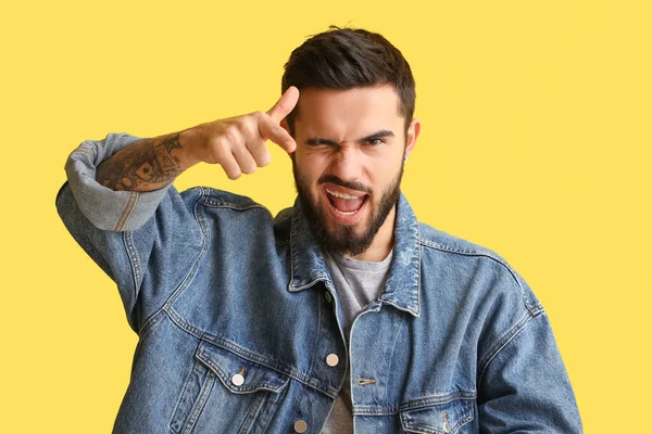 Bearded Man Pointing Viewer Winking Yellow Background — Stock Photo, Image