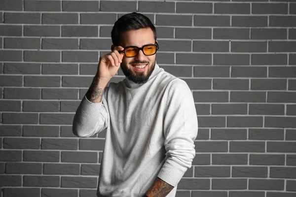 Bearded Man Wearing Stylish Sunglasses Grey Brick Wall —  Fotos de Stock