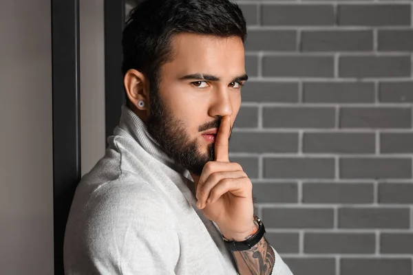 Young Bearded Man Showing Keep Silence Gesture Grey Brick Wall — 스톡 사진