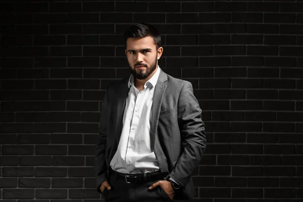 Bearded Businessman Keeping Hands Pockets Dark Background — Stockfoto