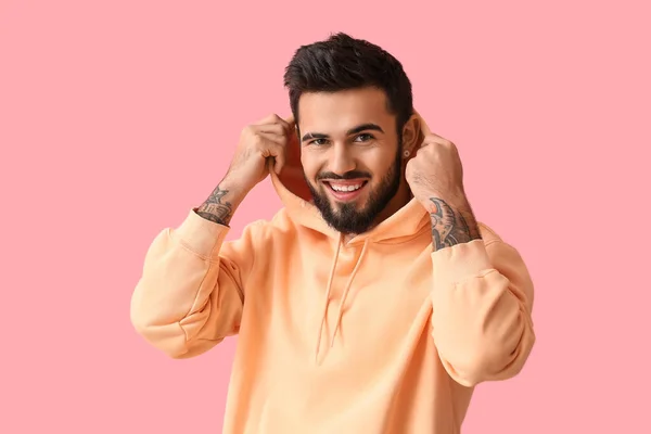 Fashionable Bearded Man Wearing Hoodie Pink Background — стоковое фото