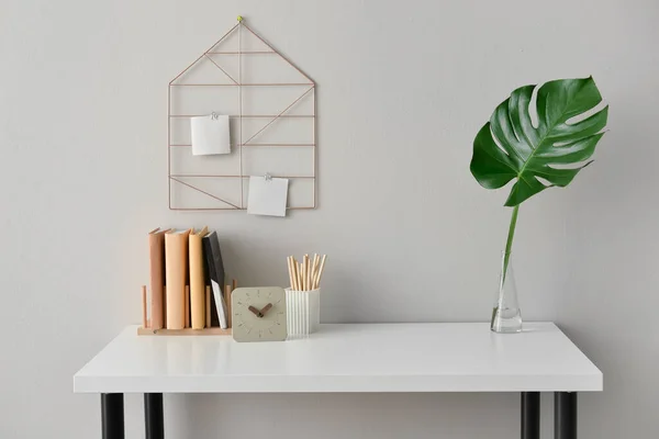 Stylish Workplace Books Clock Vase Tropical Leaf Light Wall — Stock Photo, Image